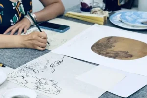 chinese painting master working.webp
