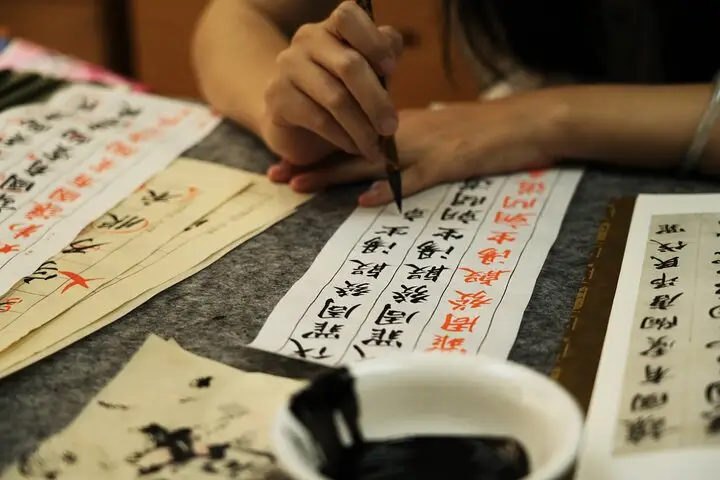 master calligraphy writing chinese character.webp